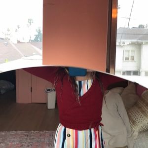 Red ballet or gymnastics small sweater cover up.